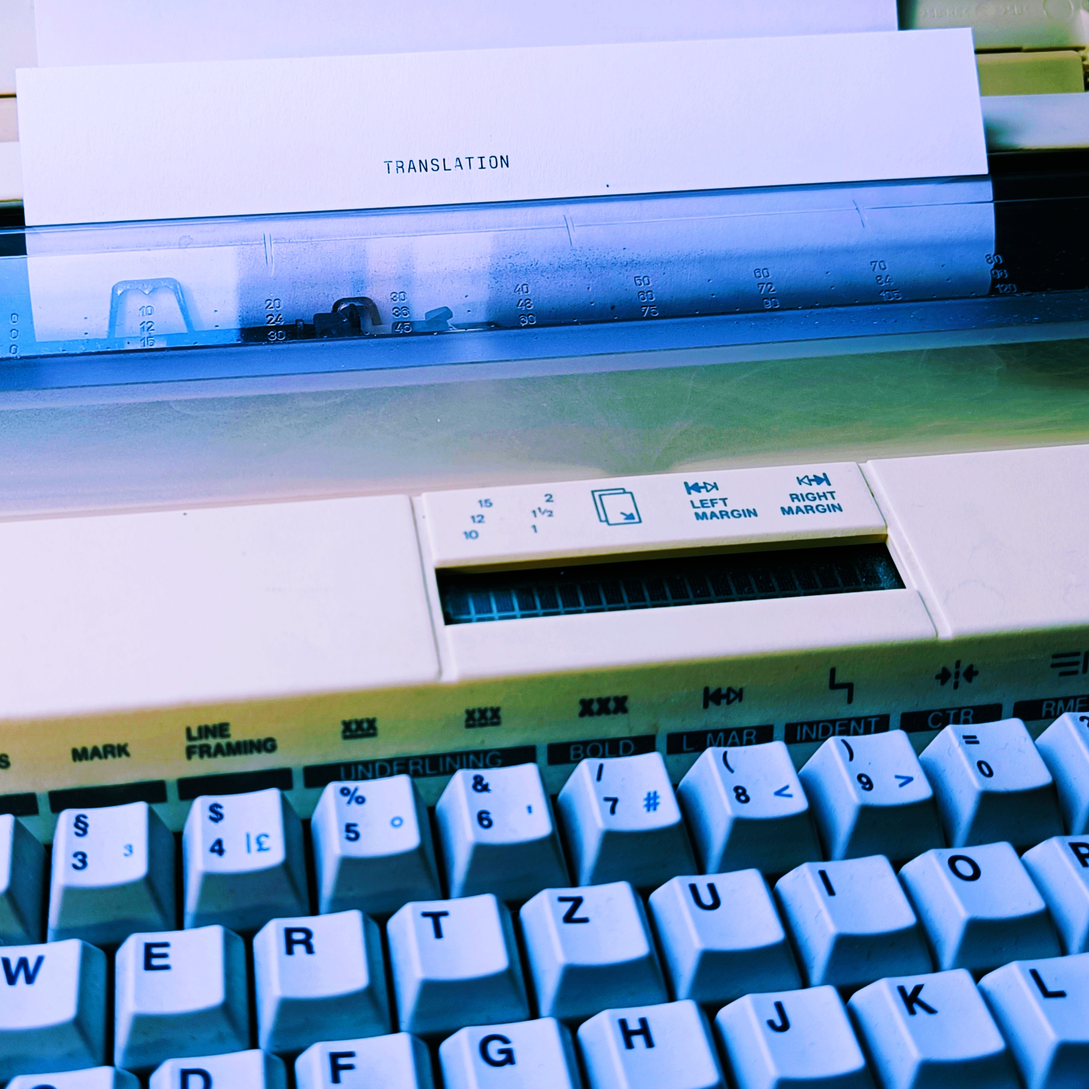 Typewriter with paper that says "Translation" on it